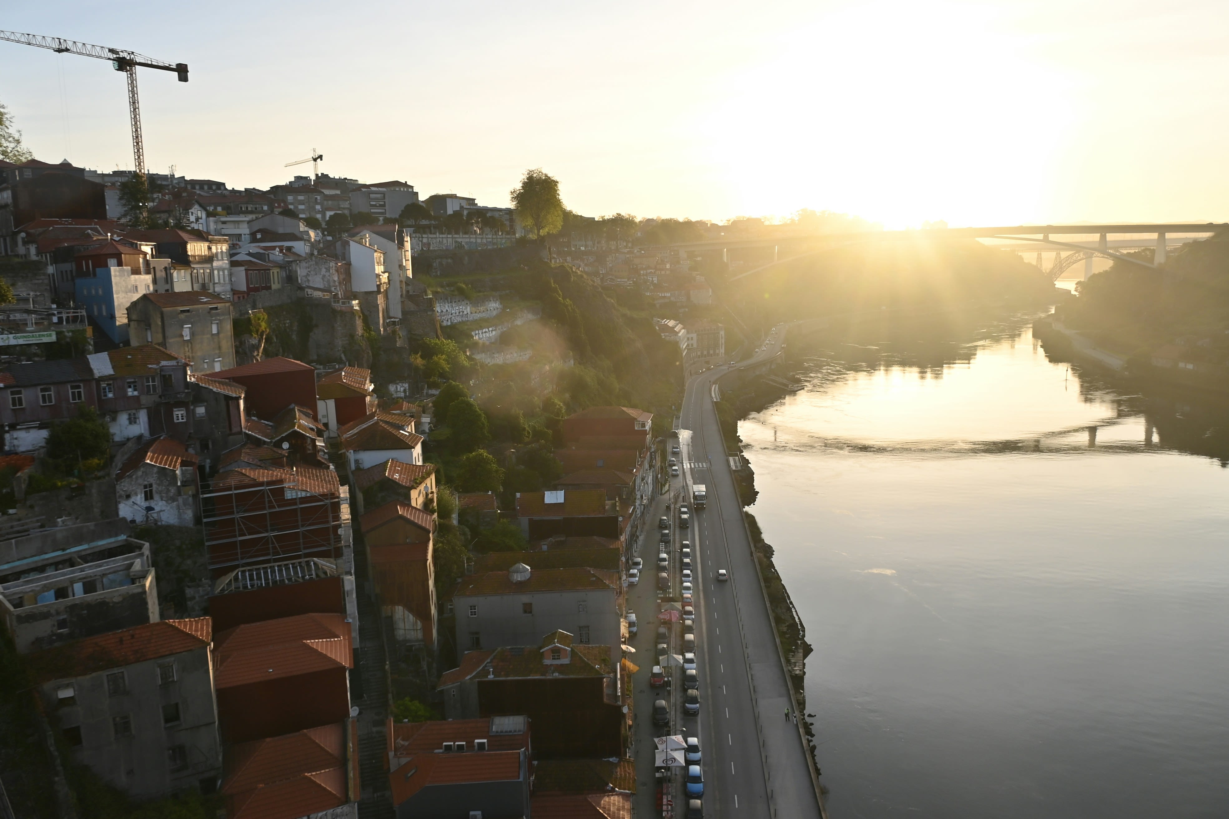 a river running through a city next to a bridge